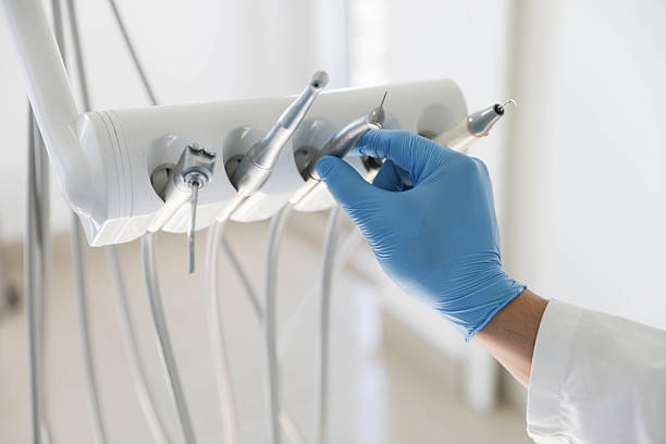 Professional Tooth Extraction technician working in Raymond, WA